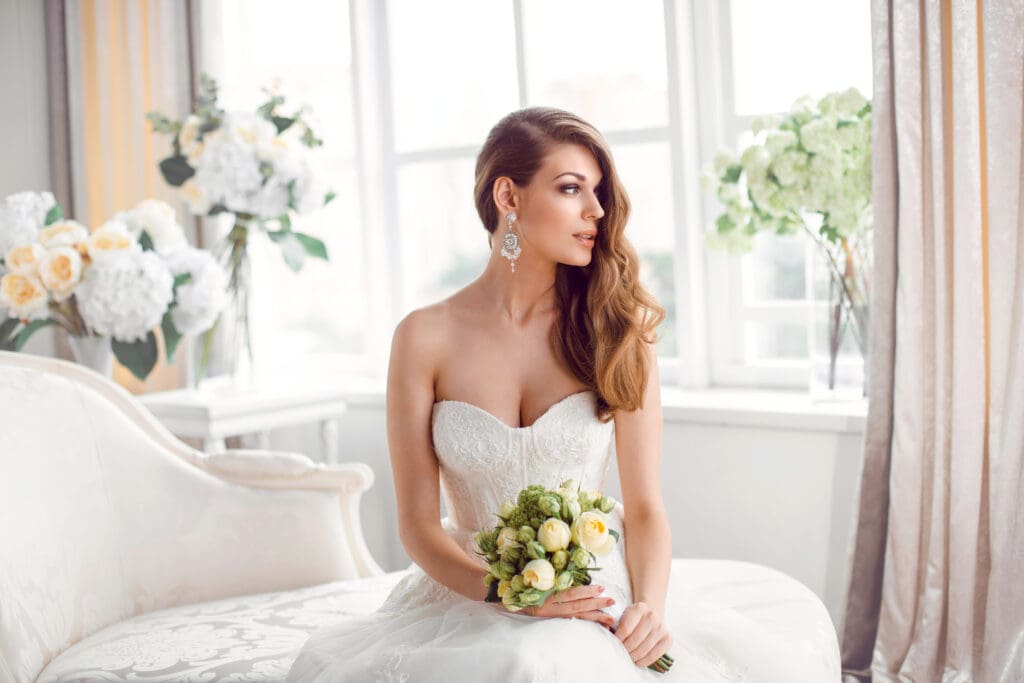Wedding.,Bride,In,Beautiful,Dress,Sitting,On,Sofa,Indoors,In Wedding.,Bride,In,Beautiful,Dress,Sitting,On,Sofa,Indoors,In